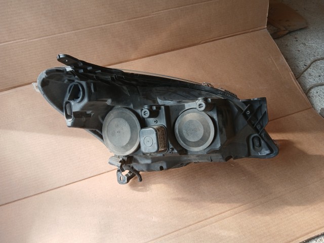 10020 Opel H astra 2004-2014 Lámpa , Fényszóró Használt sima Bal első  Hella