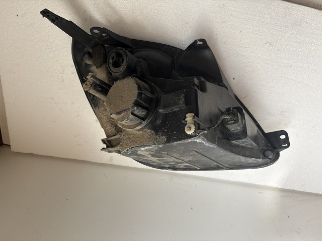11510 Ford Fiesta v 2004-2008 Lámpa , Fényszóró Használt Bal első 